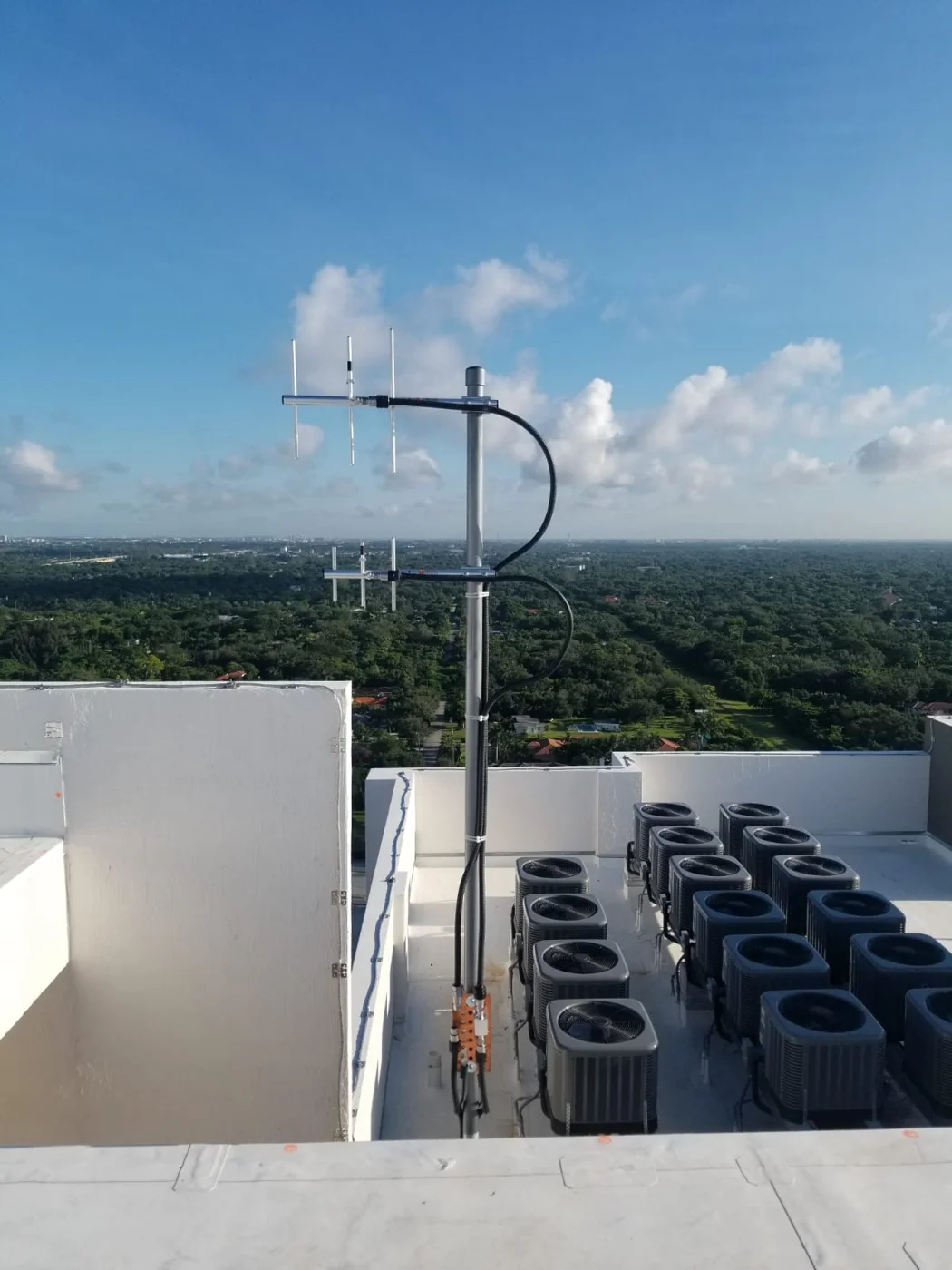 Public safety radio antennas mounted on a rooftop mast