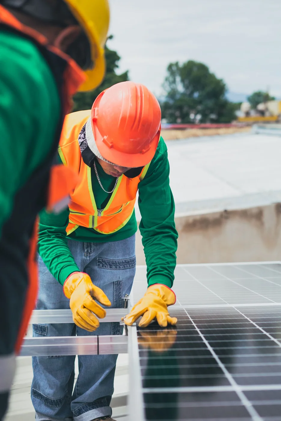 Workers installing photovoltaic panels